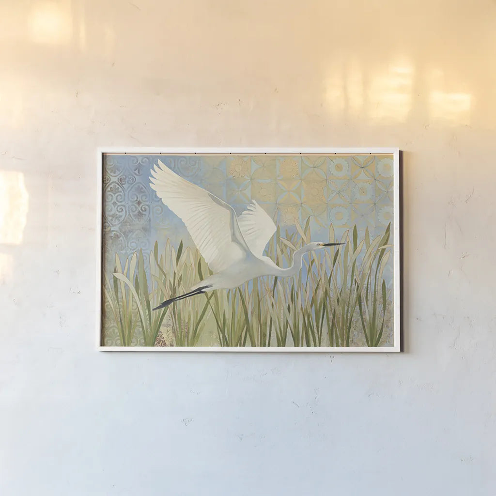Snowy Egret in Flight by Kathrine Lovell. shown as a paper print in a white frame. Available as a archival giclee rolled canvas, fine art paper, or poster print. SKU 29660i.