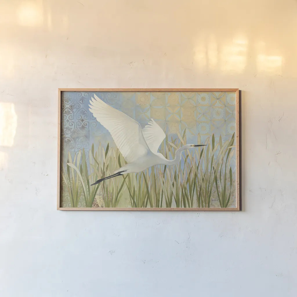 Snowy Egret in Flight v2 by Kathrine Lovell. shown as a paper print in a natural frame. Available as a archival giclee rolled canvas, fine art paper, or poster print. SKU 42466i.