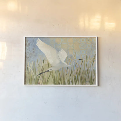 Snowy Egret in Flight v2 by Kathrine Lovell. shown as a paper print in a white frame. Available as a archival giclee rolled canvas, fine art paper, or poster print. SKU 42466i.