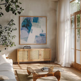 Abstract Layers III Blue by Kathy Ferguson. Shown in a natural wood frame in a cozy modern living room. Available as an archival giclee rolled canvas, fine art paper, or poster print. SKU 72694a.