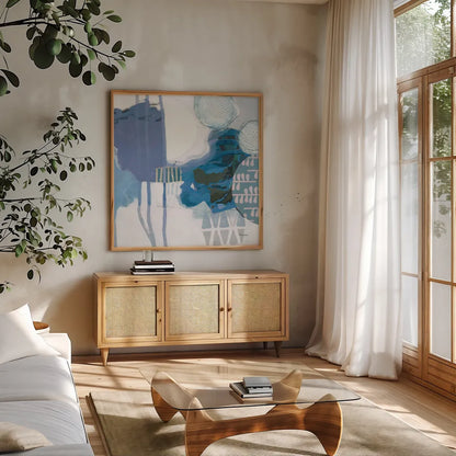 Abstract Layers IV Blue by Kathy Ferguson. Shown in a natural wood frame in a cozy modern living room. Available as an archival giclee rolled canvas, fine art paper, or poster print. SKU 72695a.