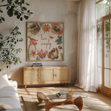 Antiquarian Blooms VII by Katie Pertiet. Shown in a natural wood frame in a cozy modern living room. Available as an archival giclee rolled canvas, fine art paper, or poster print. SKU 62246a.