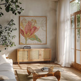 Bookshelf Botanical III by Katie Pertiet. Shown in a natural wood frame in a cozy modern living room. Available as an archival giclee rolled canvas, fine art paper, or poster print. SKU 29054a.