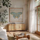 Bookshelf Botanical VIII by Katie Pertiet. Shown in a natural wood frame in a cozy modern living room. Available as an archival giclee rolled canvas, fine art paper, or poster print. SKU 29059a.