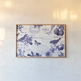 Botanical Blue I by Katie Pertiet. shown as a paper print in a natural frame. Available as a archival giclee rolled canvas, fine art paper, or poster print. SKU 42172i.