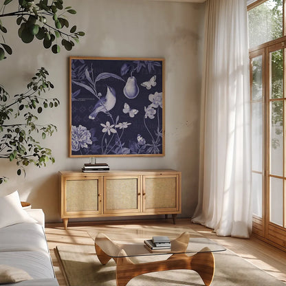 Botanical Blue V by Katie Pertiet. Shown in a natural wood frame in a cozy modern living room. Available as an archival giclee rolled canvas, fine art paper, or poster print. SKU 42176a.