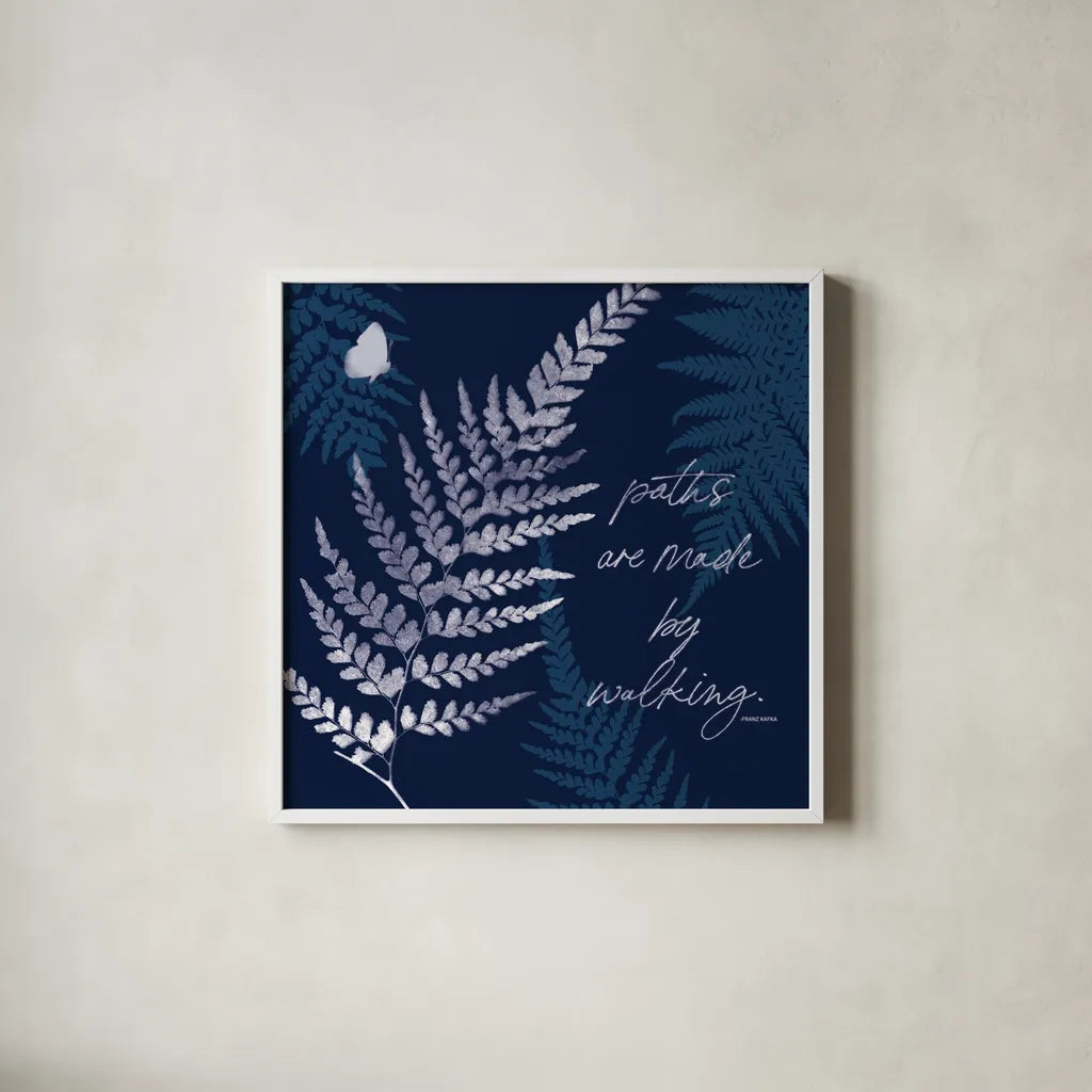 Dark True Blue III by Katie Pertiet. Shown in a crisp white glass frame for a clean and minimalist style. Available as an archival giclee rolled canvas, fine art paper, or poster print. SKU 66619a.