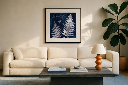 Dark True Blue VI by Katie Pertiet. Displayed in a glass frame with matte in a clean modern living room. Available as an archival giclee rolled canvas, fine art paper, or poster print. SKU 66620a.