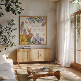 Easter Garden V by Katie Pertiet. Shown in a natural wood frame in a cozy modern living room. Available as an archival giclee rolled canvas, fine art paper, or poster print. SKU 72537a.