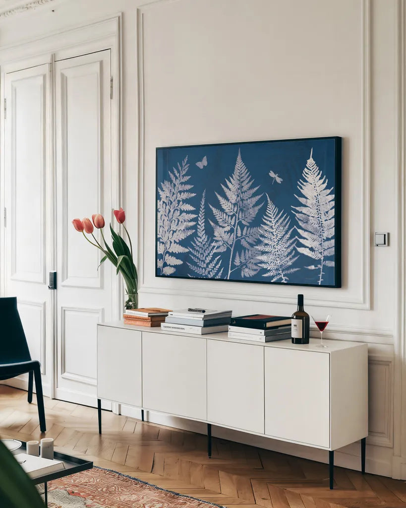 True Blue I by Katie Pertiet. shown as a framed stretched canvas in a living room above a console. Available as a archival giclee rolled canvas, fine art paper, or poster print. SKU 62861i.