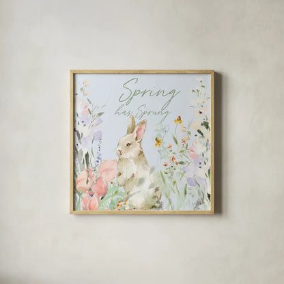 Blooming Bunnies IV Spring by Katrina Pete. Shown in a natural wood glass frame for a timeless modern aesthetic. Available as an archival giclee rolled canvas, fine art paper, or poster print. SKU 89678a.