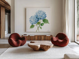 Blue Hydrangea I by Katrina Pete. Shown as extra-large giant wall art in a modern living room. Available as an archival giclee rolled canvas, fine art paper, or poster print. SKU 96895a.