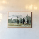 Cabin in the Woods by Katrina Pete. shown as a paper print in a natural frame. Available as a archival giclee rolled canvas, fine art paper, or poster print. SKU 83015i.