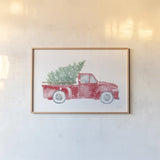 Christmas Truck by Katrina Pete. shown as a paper print in a natural frame. Available as a archival giclee rolled canvas, fine art paper, or poster print. SKU 67457i.