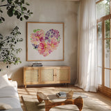Floral Heart Petals by Katrina Pete. Shown in a natural wood frame in a cozy modern living room. Available as an archival giclee rolled canvas, fine art paper, or poster print. SKU 102528a.