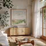 Gentle Landscape I by Katrina Pete. Shown in a natural wood frame in a cozy modern living room. Available as an archival giclee rolled canvas, fine art paper, or poster print. SKU 67126a.