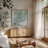 Pussy Willows Square by Katrina Pete. Shown in a natural wood frame in a cozy modern living room. Available as an archival giclee rolled canvas, fine art paper, or poster print. SKU 71683a.