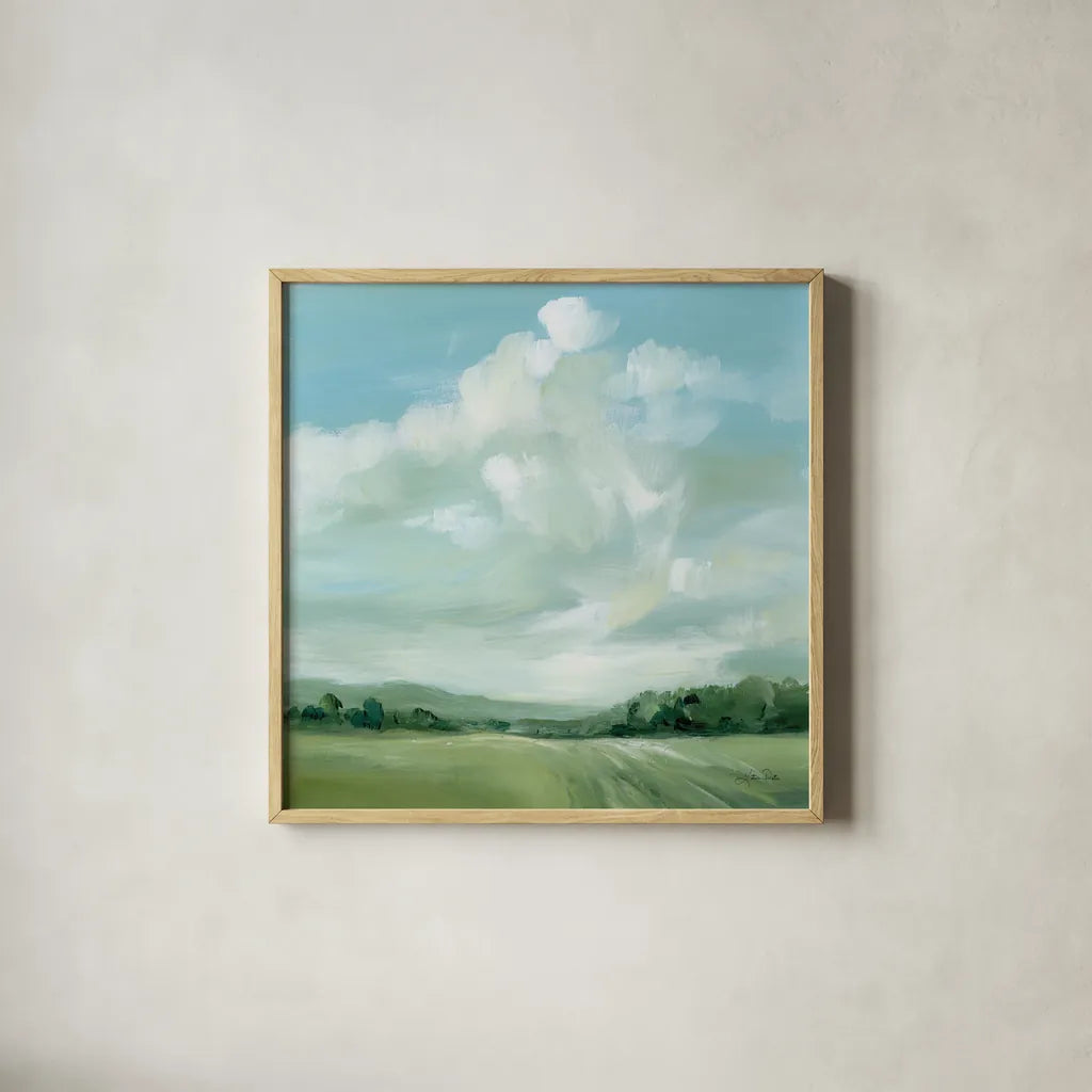 Summer Clouds by Katrina Pete. Shown in a natural wood glass frame for a timeless modern aesthetic. Available as an archival giclee rolled canvas, fine art paper, or poster print. SKU 73252a.