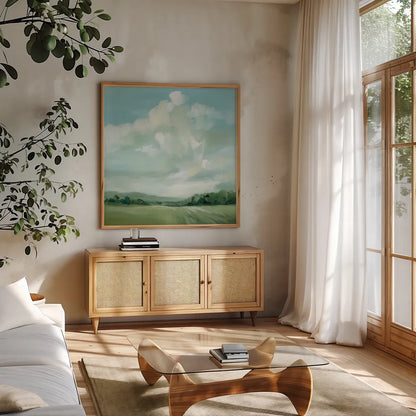 Summer Clouds by Katrina Pete. Shown in a natural wood frame in a cozy modern living room. Available as an archival giclee rolled canvas, fine art paper, or poster print. SKU 73252a.