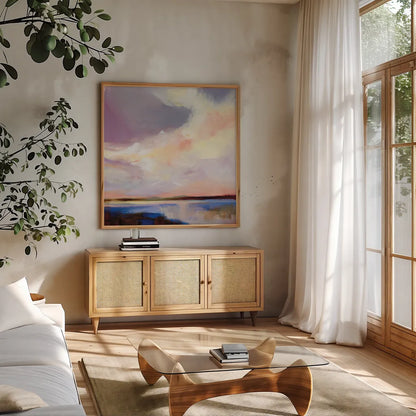 Sunset on Gull Lake by Katrina Pete. Shown in a natural wood frame in a cozy modern living room. Available as an archival giclee rolled canvas, fine art paper, or poster print. SKU 92799a.