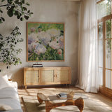 White Impressionistic Peonies by Katrina Pete. Shown in a natural wood frame in a cozy modern living room. Available as an archival giclee rolled canvas, fine art paper, or poster print. SKU 94272a.