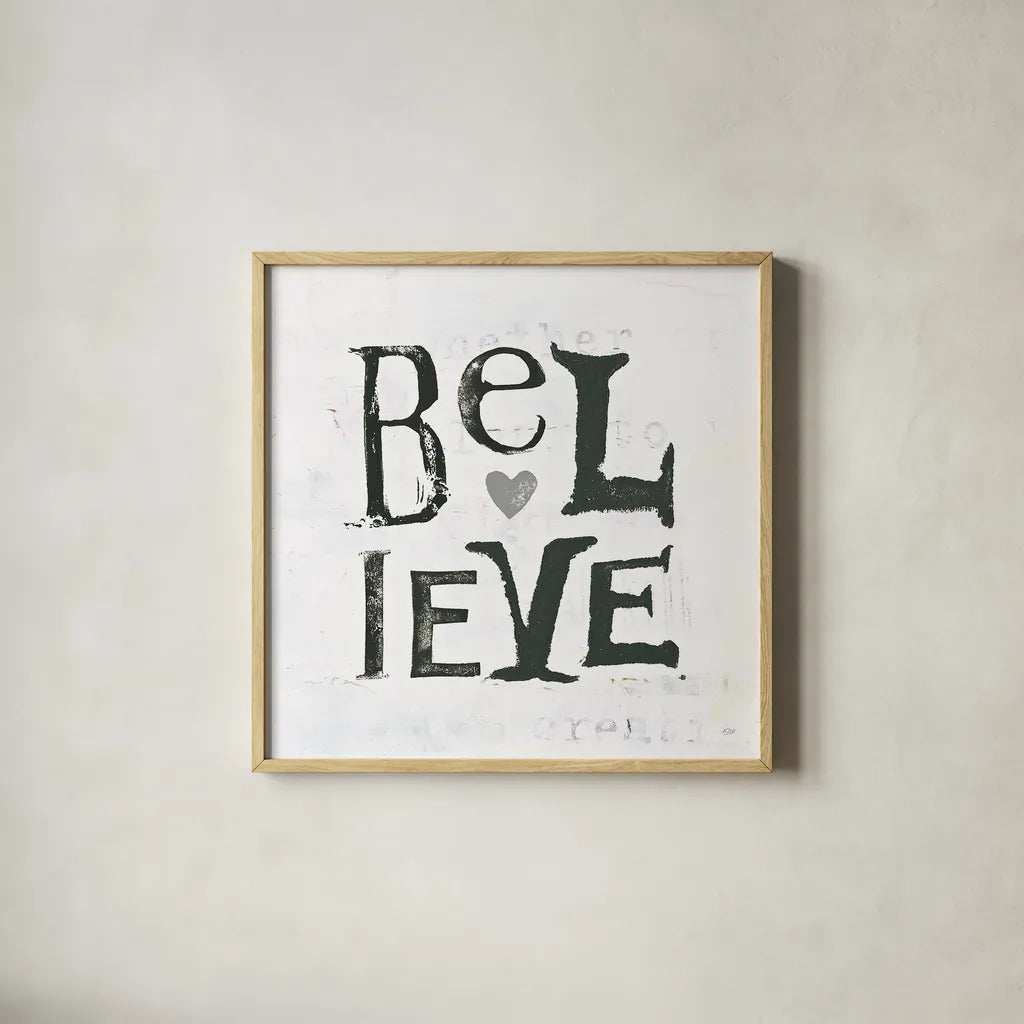 Believe Gray Hearts by Kellie Day. Shown in a natural wood glass frame for a timeless modern aesthetic. Available as an archival giclee rolled canvas, fine art paper, or poster print. SKU 31340a.