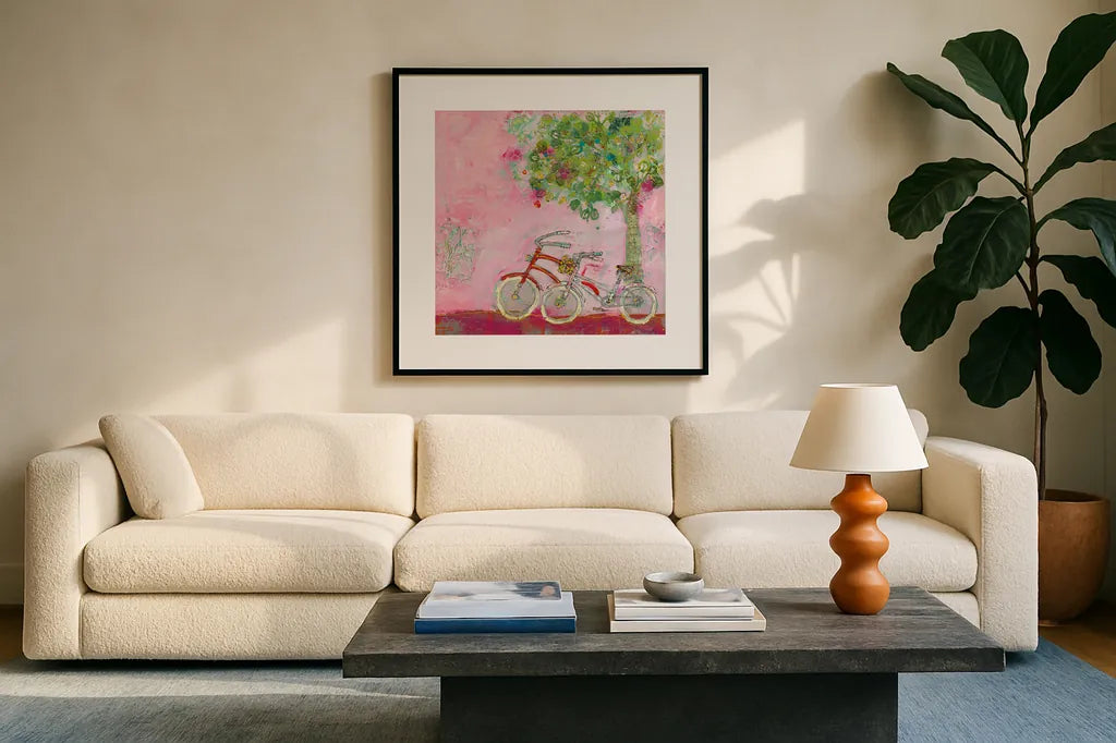 Pink Bicycles by Kellie Day. Displayed in a glass frame with matte in a clean modern living room. Available as an archival giclee rolled canvas, fine art paper, or poster print. SKU 39678a.