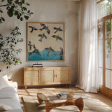 Ravens Rising by Kellie Day. Shown in a natural wood frame in a cozy modern living room. Available as an archival giclee rolled canvas, fine art paper, or poster print. SKU 59934a.