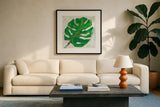 Single Leaf Play on White by Kellie Day. Displayed in a glass frame with matte in a clean modern living room. Available as an archival giclee rolled canvas, fine art paper, or poster print. SKU 28279a.