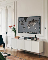 Love the World Map by Kent Youngstrom. shown as a framed stretched canvas in a living room above a console. Available as a archival giclee rolled canvas, fine art paper, or poster print. SKU 81315i.