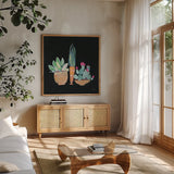 Cactus Party I by Kristy Rice. Shown in a natural wood frame in a cozy modern living room. Available as an archival giclee rolled canvas, fine art paper, or poster print. SKU 98937a.