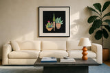 Cactus Party II by Kristy Rice. Displayed in a glass frame with matte in a clean modern living room. Available as an archival giclee rolled canvas, fine art paper, or poster print. SKU 98938a.