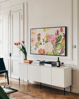 Desert Rose V by Kristy Rice. shown as a framed stretched canvas in a living room above a console. Available as a archival giclee rolled canvas, fine art paper, or poster print. SKU 38791i.