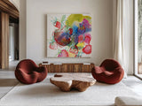 Falling Strawberries by Kristy Rice. Shown as extra-large giant wall art in a modern living room. Available as an archival giclee rolled canvas, fine art paper, or poster print. SKU 101998a.