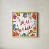 Fridas Flower Fancy II by Kristy Rice. Shown in a natural wood glass frame for a timeless modern aesthetic. Available as an archival giclee rolled canvas, fine art paper, or poster print. SKU 53335a.