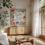 Fridas Flower Fancy III by Kristy Rice. Shown in a natural wood frame in a cozy modern living room. Available as an archival giclee rolled canvas, fine art paper, or poster print. SKU 53336a.