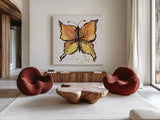 Jewel Butterfly II by Kristy Rice. Shown as extra-large giant wall art in a modern living room. Available as an archival giclee rolled canvas, fine art paper, or poster print. SKU 94634a.