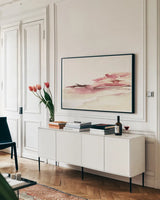Pink Coastal Sunset by Kristy Rice. shown as a framed stretched canvas in a living room above a console. Available as a archival giclee rolled canvas, fine art paper, or poster print. SKU 67072i.