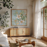 Dogwood Spring II by Krystal Adams. Shown in a natural wood frame in a cozy modern living room. Available as an archival giclee rolled canvas, fine art paper, or poster print. SKU 103647a.