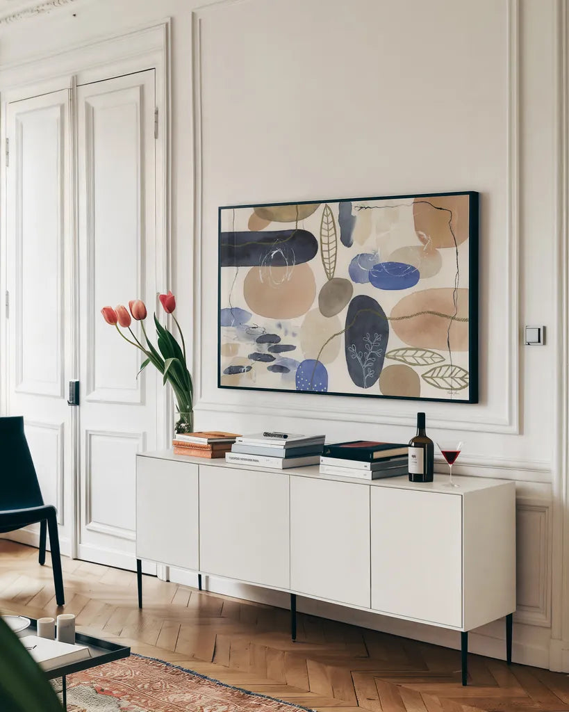 Leaves and Stones I by Laura Horn. shown as a framed stretched canvas in a living room above a console. Available as a archival giclee rolled canvas, fine art paper, or poster print. SKU 78483i.