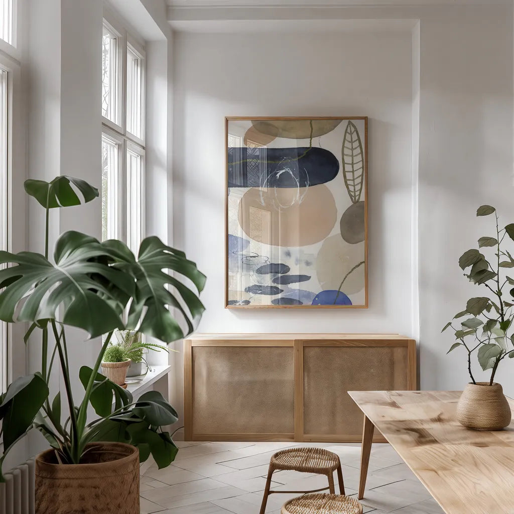 Leaves and Stones IV by Laura Horn. shown as a print in a natural wood frame in a dining room. Available as a archival giclee rolled canvas, fine art paper, or poster print. SKU 78486h.