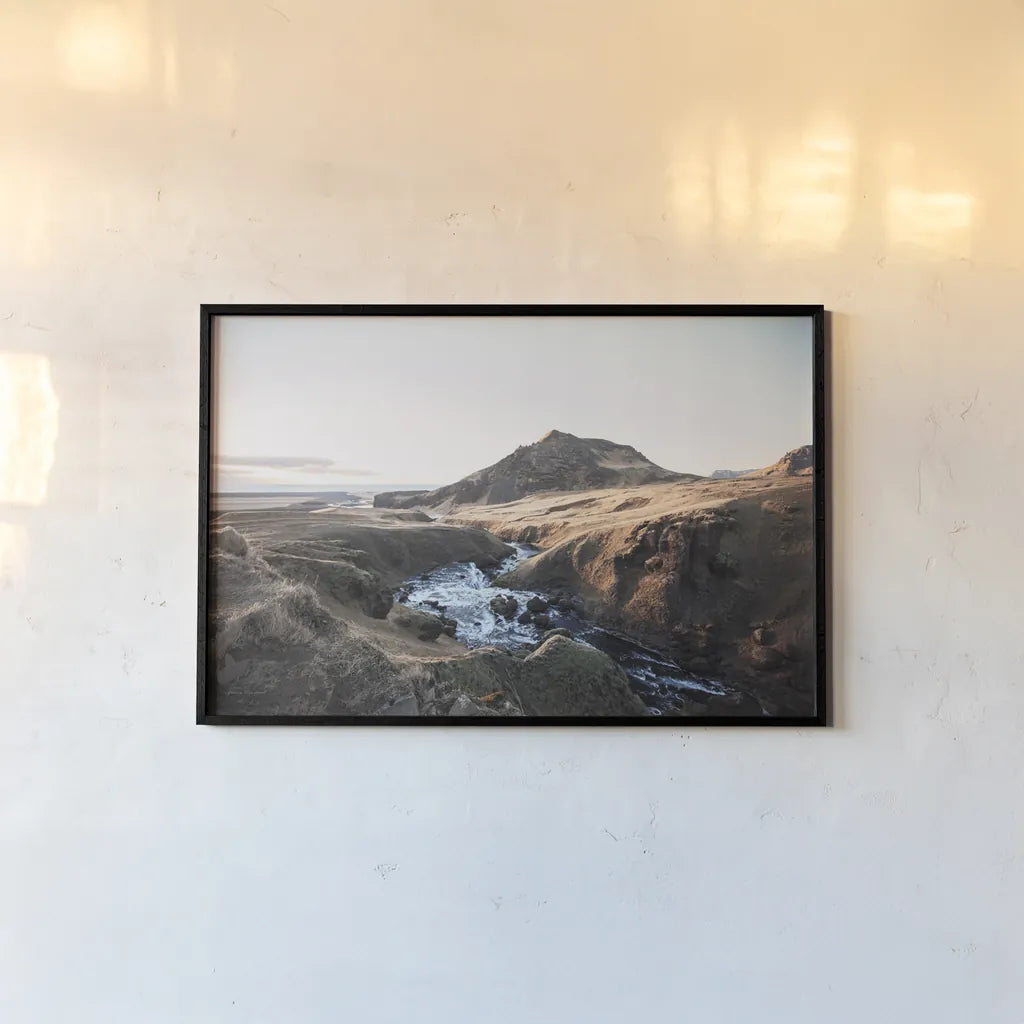 Above Skogafoss by Laura Marshall. shown as a paper print in a black flame. Available as a archival giclee rolled canvas, fine art paper, or poster print. SKU 69903i.