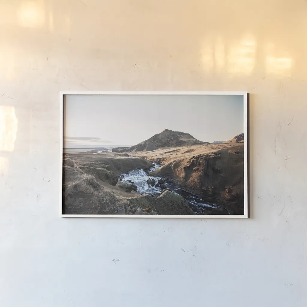 Above Skogafoss by Laura Marshall. shown as a paper print in a white frame. Available as a archival giclee rolled canvas, fine art paper, or poster print. SKU 69903i.