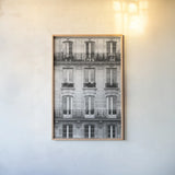Across the Street II by Laura Marshall. shown as a paper print in a natural frame. Available as a archival giclee rolled canvas, fine art paper, or poster print. SKU 21915h.
