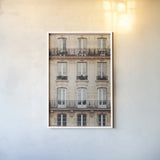 Across the Street II Neutral by Laura Marshall. shown as a paper print in a white frame. Available as a archival giclee rolled canvas, fine art paper, or poster print. SKU 53121h.