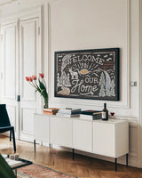 Adventurous III Black by Laura Marshall. shown as a framed stretched canvas in a living room above a console. Available as a archival giclee rolled canvas, fine art paper, or poster print. SKU 58462i.