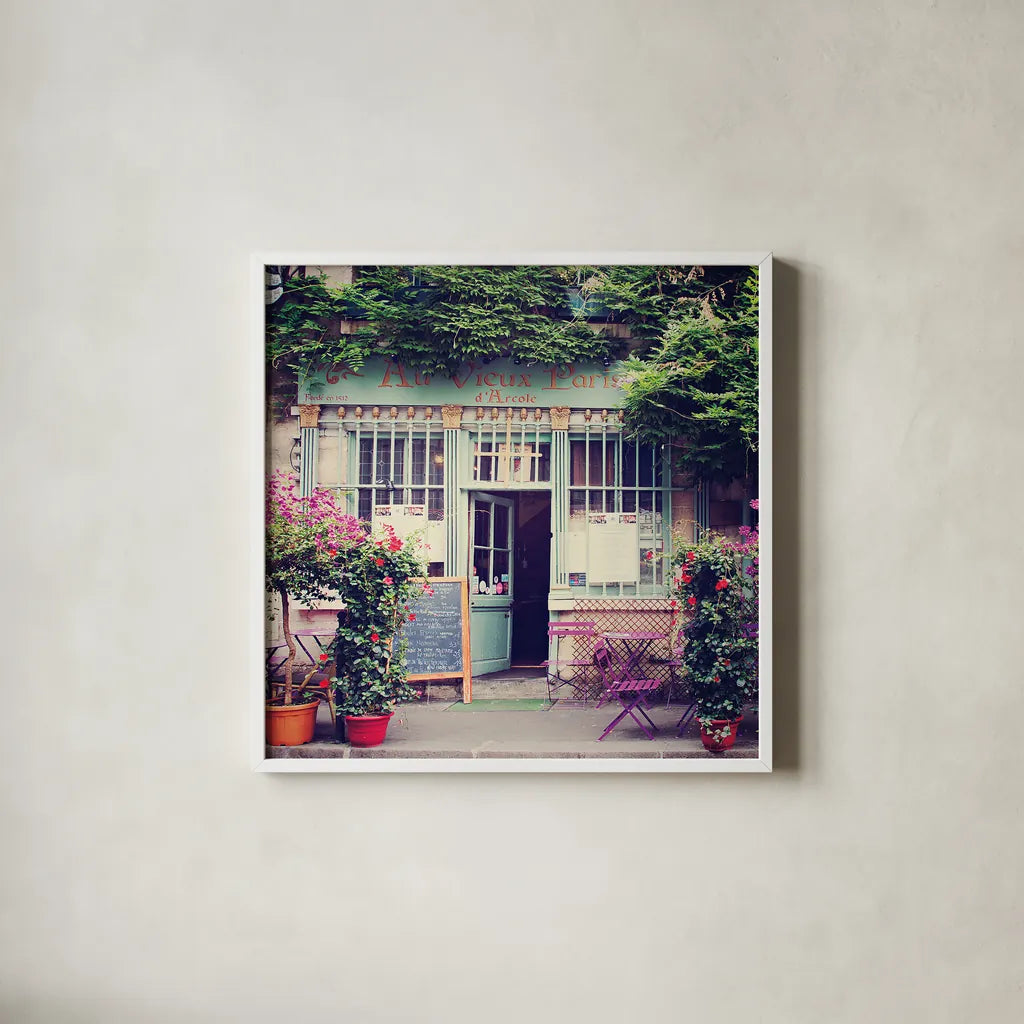 Au Vieux Paris by Laura Marshall. Shown in a crisp white glass frame for a clean and minimalist style. Available as an archival giclee rolled canvas, fine art paper, or poster print. SKU 21918a.