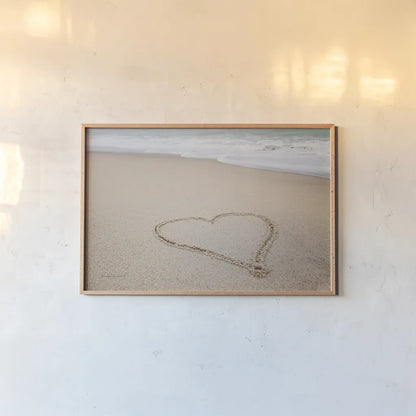 Beach Love I by Laura Marshall. shown as a paper print in a natural frame. Available as a archival giclee rolled canvas, fine art paper, or poster print. SKU 39637i.