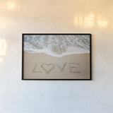 Beach Love II by Laura Marshall. shown as a paper print in a black flame. Available as a archival giclee rolled canvas, fine art paper, or poster print. SKU 39638i.