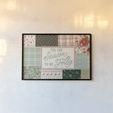 Blooming Christmas I by Laura Marshall. shown as a paper print in a black flame. Available as a archival giclee rolled canvas, fine art paper, or poster print. SKU 102976i.